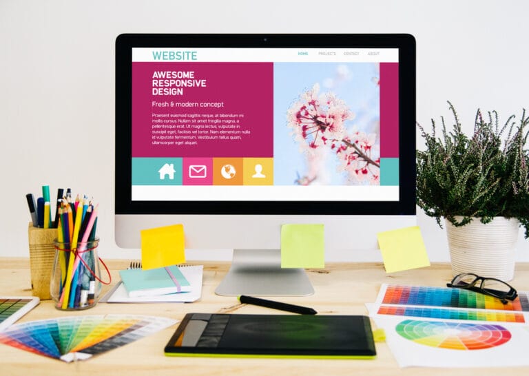 An enterprise web development project: stationery desktop with design, graphic tablet, and other creativity tools