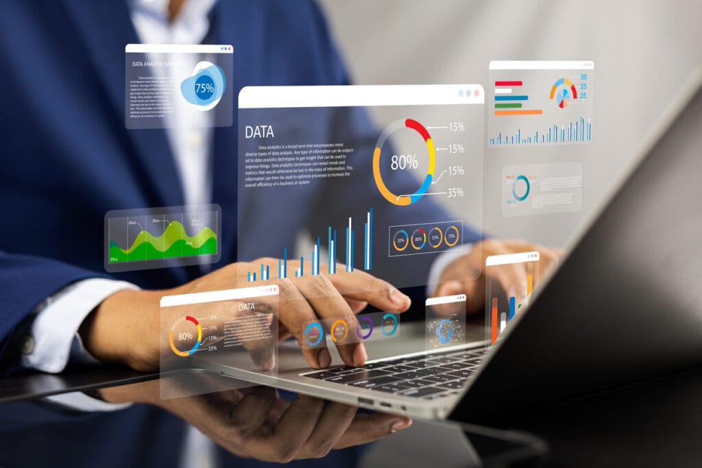 Analyst using a laptop with overlay of data analysis charts for an enterprise media company