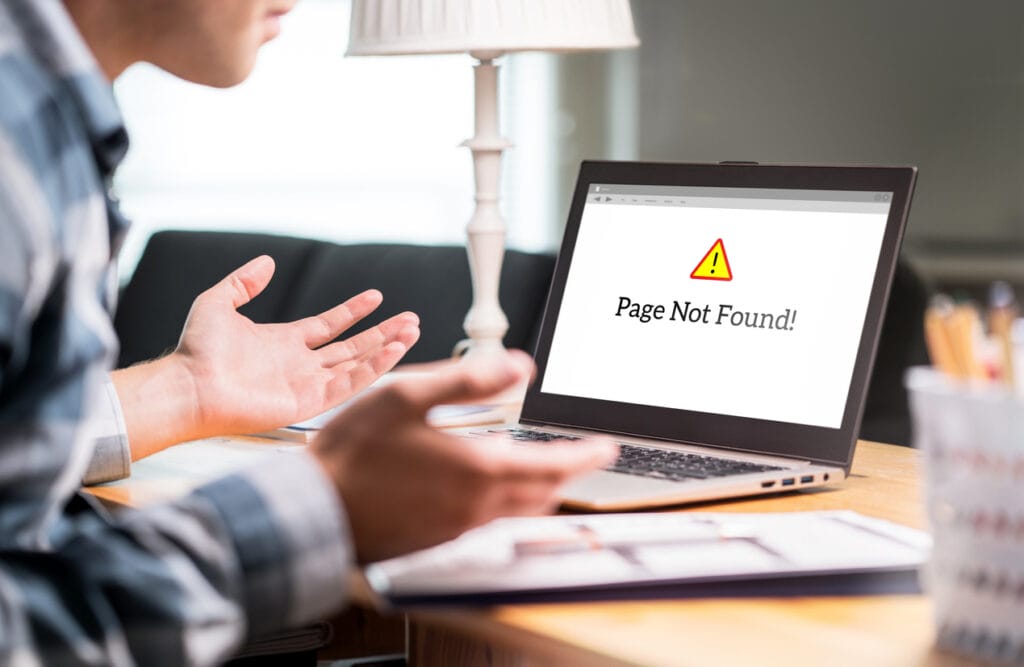 Issues in editorial workflows: Person looking at Page not Found notification on laptop
