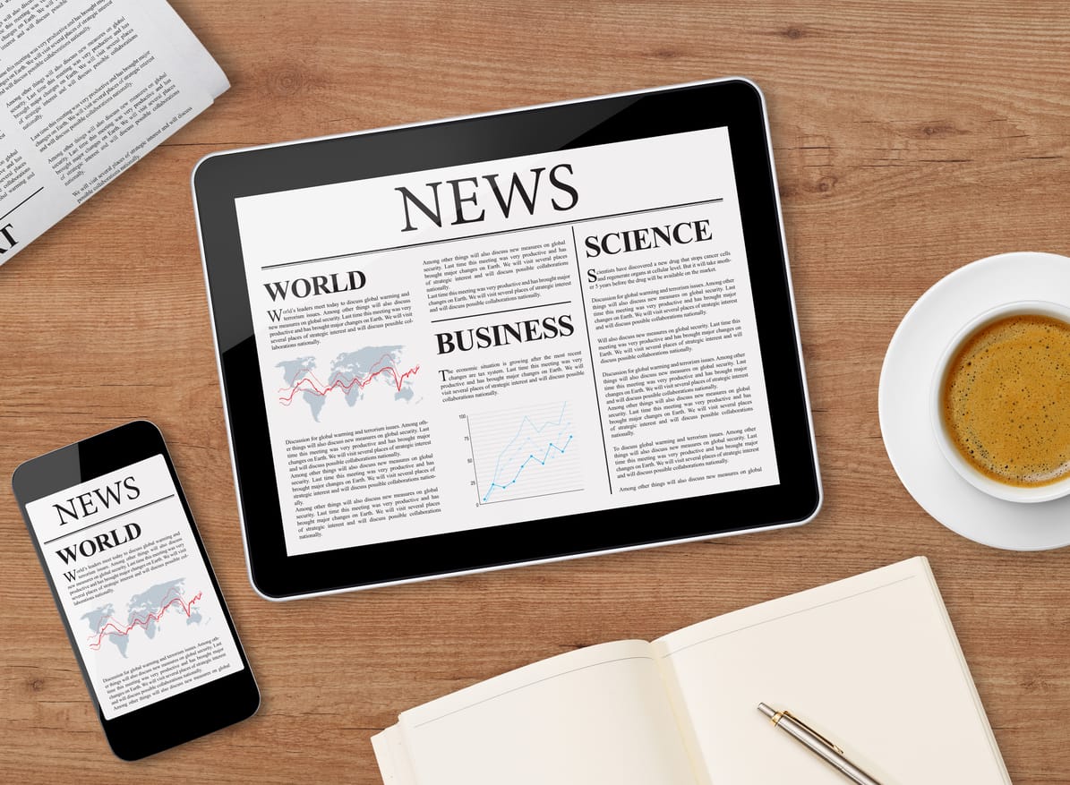 Gutenberg Optimization: Online news articles on a digital tablet and a mobile phone on a desk