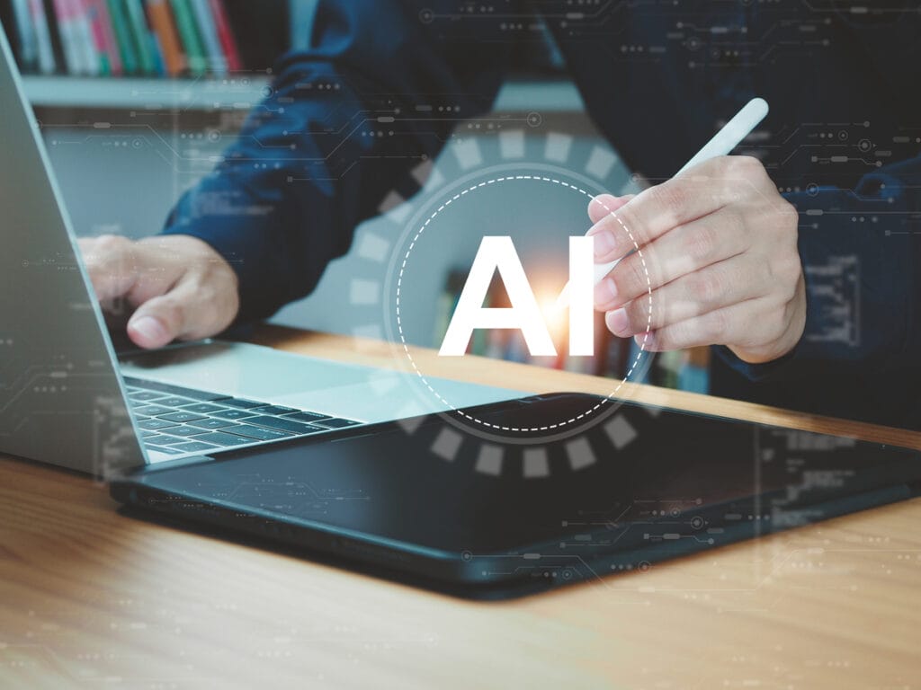 Health and wellness content: Cropped shot of a man using a laptop and tablet with an overlay of the letters AI