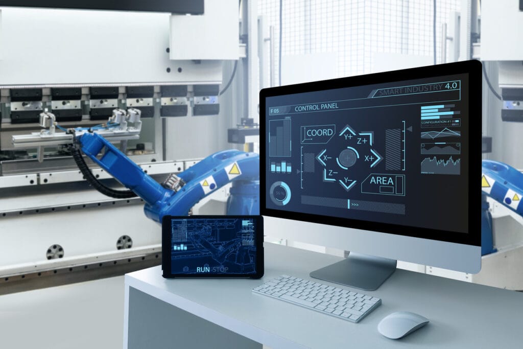 Web platforms for manufacturers: A computer monitor and digital tablet showing a control panel for a manufacturing process
